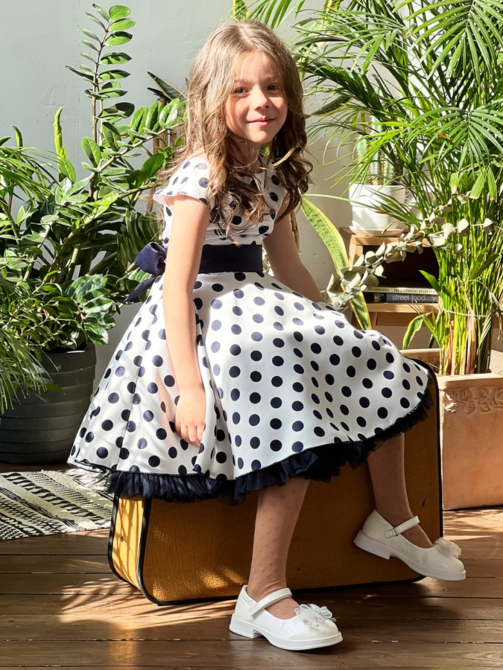 Платье для девочки нарядное БУШОН ST10, стиляги цвет белый, темно-синий пояс, принт темно-синий горошек 